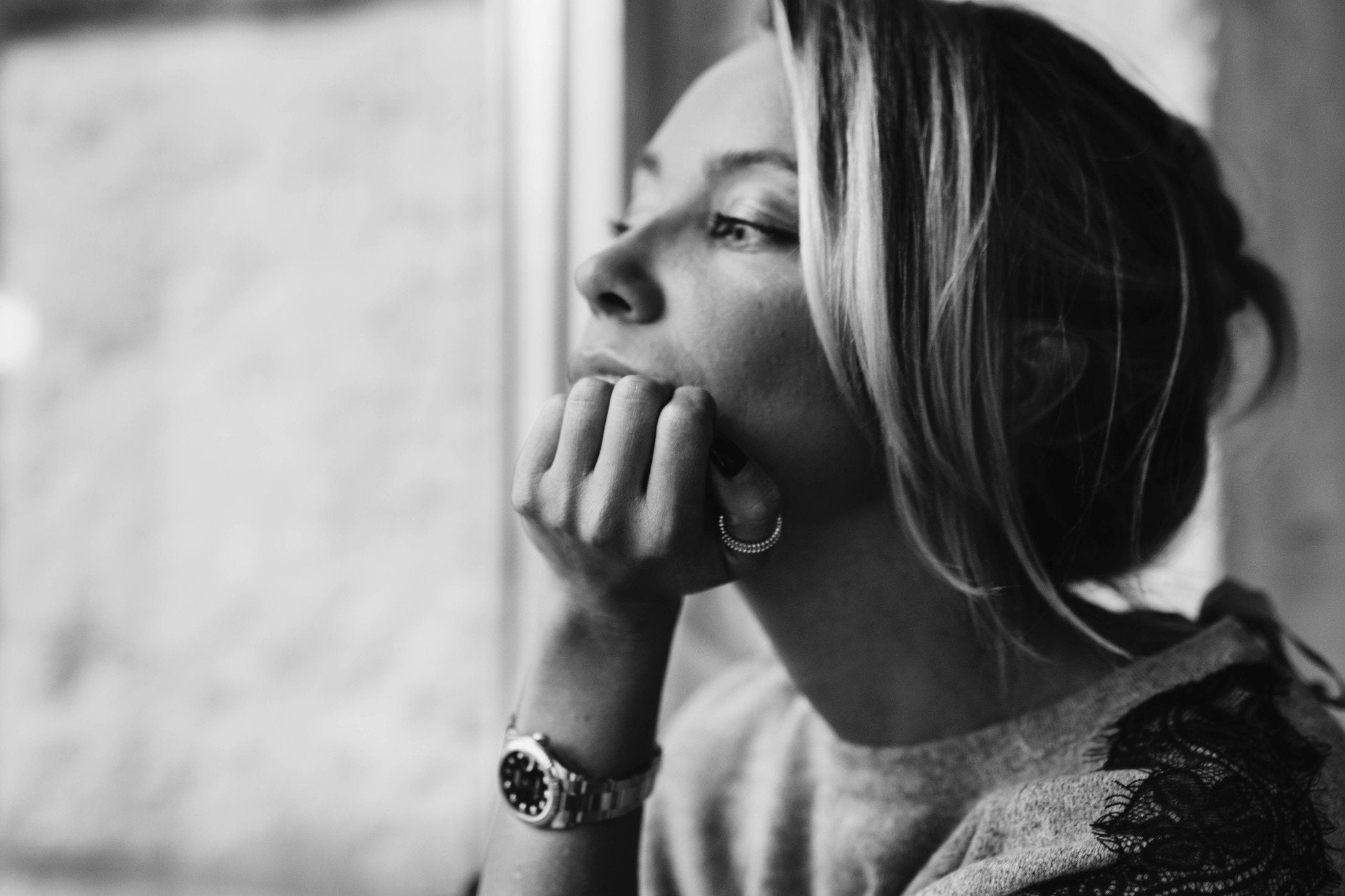 Beautiful Woman Sitting Looking Out a Window 
