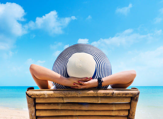 Woman resting under the sun on the beach